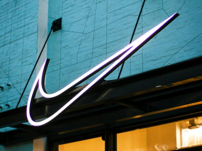 Nike company culture, organizational core values, traits, advantages, sporting goods business analysis case study, Swoosh sign