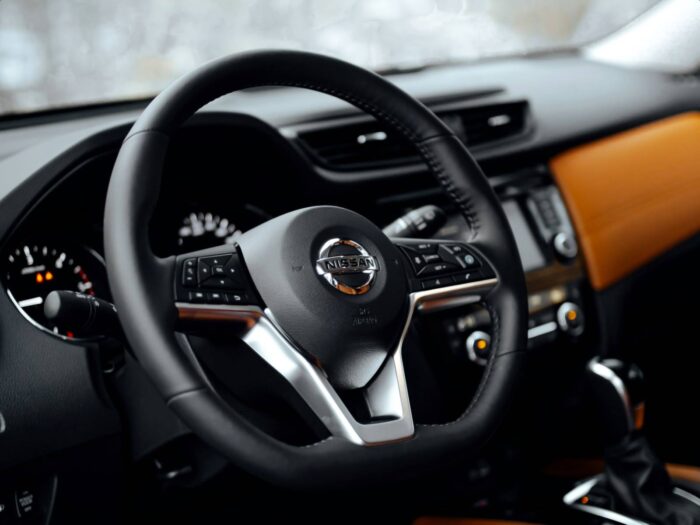 Nissan vision statement, mission statement, business purpose, goals, business case study, car steering wheel and interior Nissan vision statement, mission statement, business purpose, goals, business case study, car steering wheel and interior