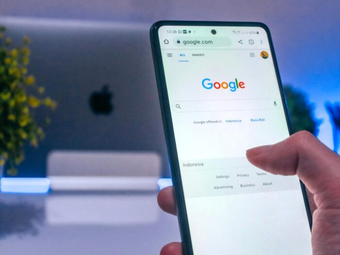Google compensation strategy, career development, Alphabet human resource management, IT business case study analysis, smartphone screen Google compensation strategy, career development, Alphabet human resource management, IT business case study analysis, smartphone screen